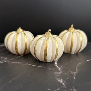 3 small pumpkin candles